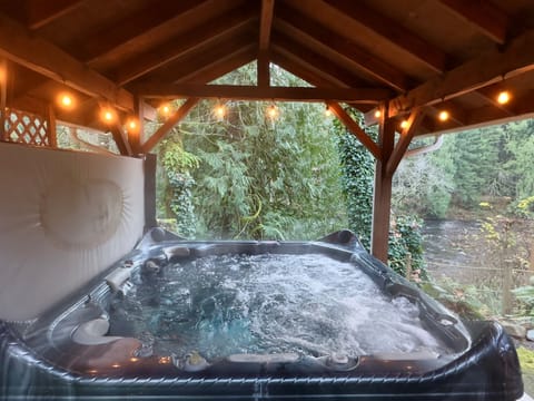 Soak the stress away in the hot tub overlooking the Salmon River.  