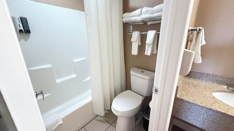 Standard Room, 2 Queen Beds, Non Smoking | Bathroom | Combined shower/tub, free toiletries, hair dryer, towels