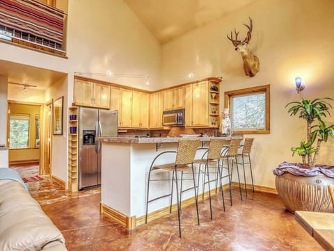 Breakfast bar area for relaxing or chatting with the family chef! View from the dining table area.