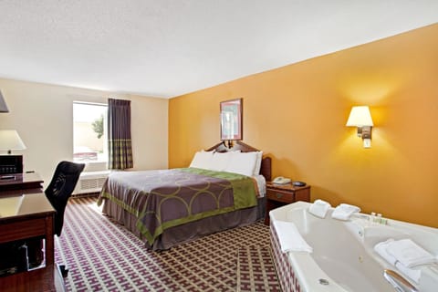 Suite, 1 King Bed, Non Smoking | Desk, laptop workspace, blackout drapes, iron/ironing board