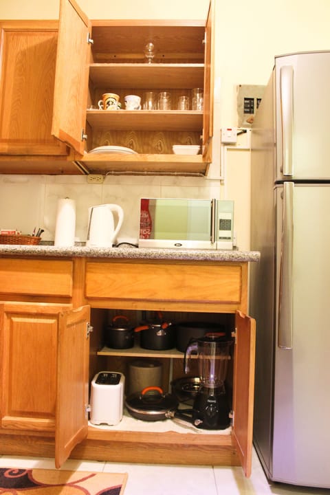 Comfort Studio, 1 Bedroom | Private kitchen | Full-size fridge, microwave, stovetop, coffee/tea maker