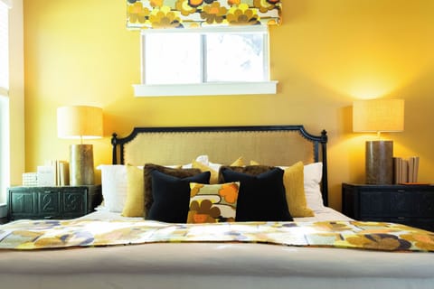 The golden walls wrap you in warmth and stylish pillows create the perfect retreat for restful nights.