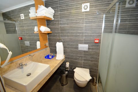 Standard Triple Room, 1 Bedroom | Bathroom | Shower, free toiletries, hair dryer, slippers