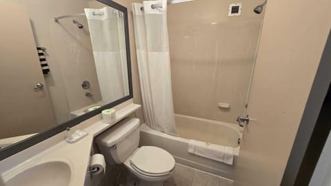 Room, 2 Double Beds | Bathroom | Free toiletries, hair dryer, towels