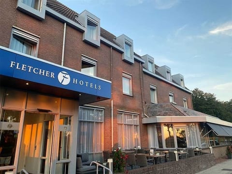 Step into a warm, inviting stay as evening light glows.