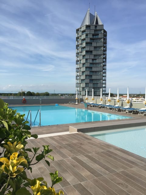 Outdoor pool, a rooftop pool, sun loungers