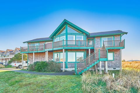 Take in the coastal atmosphere from the home’s spacious decks near the ocean
