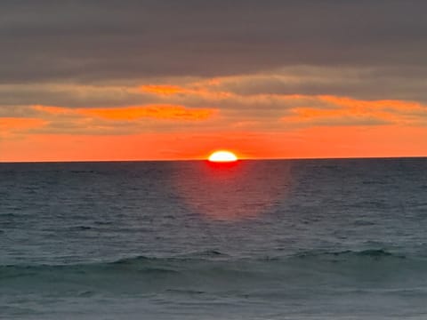 Gorgeous sunsets steps away from this near ocean front condo.  2 houses beach.