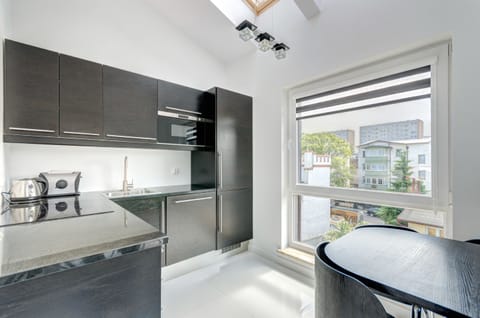 Deluxe Apartment, 1 Bedroom, Balcony (for 4 adults) | Private kitchenette | Fridge, stovetop, coffee/tea maker, electric kettle