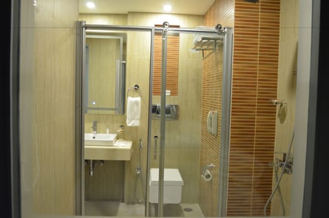 Zone Room | Bathroom | Shower, free toiletries, hair dryer, slippers