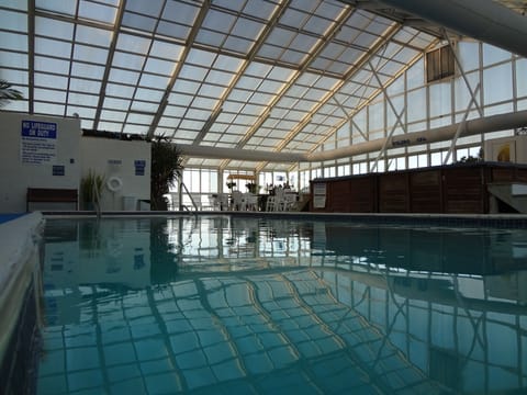 Indoor pool, seasonal outdoor pool, open 9 AM to 11 PM, sun loungers