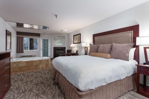 Deluxe Suite, 1 King Bed, Jetted Tub, River View | Down comforters, desk, blackout drapes, iron/ironing board