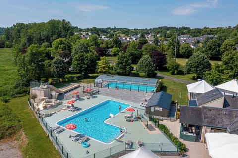 Dive into refreshing fun at the outdoor pool, complete with playful slides and sun loungers waiting for you.