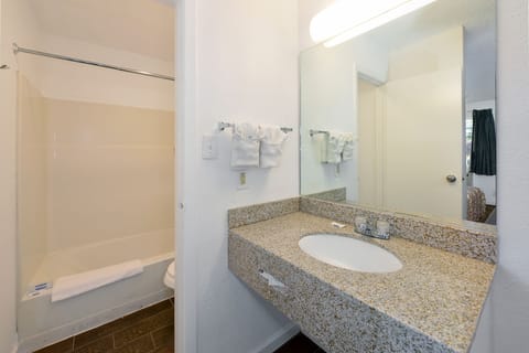 Standard Room, 2 Double Beds | Bathroom | Combined shower/tub, hair dryer, towels