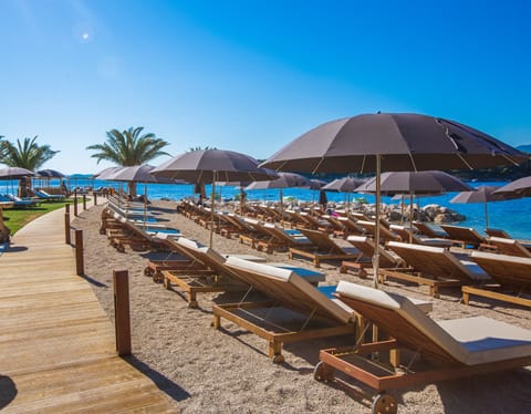 On the beach, sun loungers, beach umbrellas, beach towels