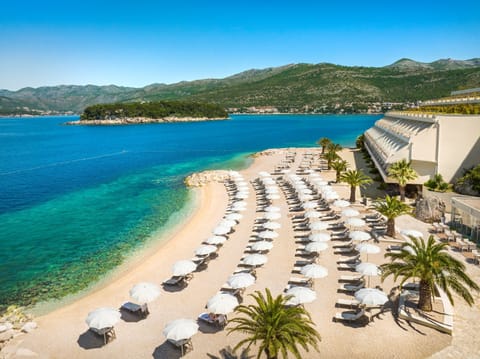 On the beach, sun loungers, beach umbrellas, beach towels