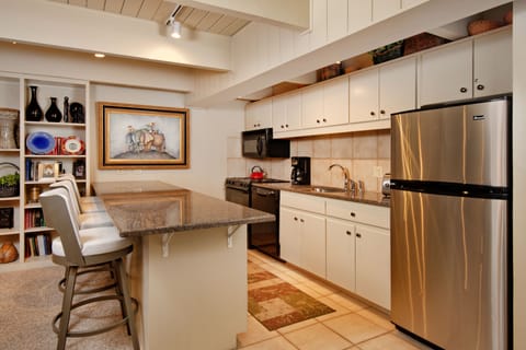 Deluxe Condo, 2 Bedrooms, Fireplace (Chateau Dumont 11) | Private kitchen | Full-size fridge, microwave, oven, stovetop