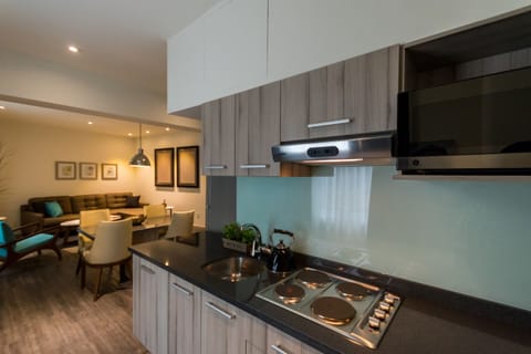 Junior Suite, 1 King Bed | Private kitchen | Fridge, microwave, stovetop, coffee/tea maker