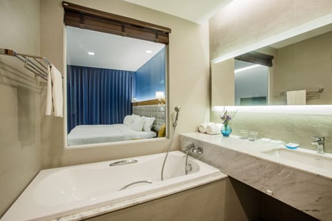 Superior Room with Balcony | Bathroom | Separate tub and shower, deep soaking tub, eco-friendly toiletries