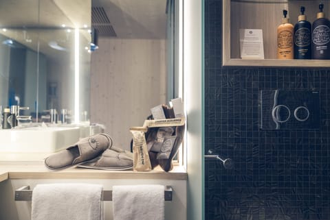 Business Plus Apartment (swiss pine bedding & eco bodycare products) | Bathroom | Shower, eco-friendly toiletries, hair dryer, towels