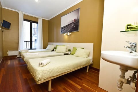 Triple Room, Shared Bathroom | In-room safe, blackout drapes, free WiFi