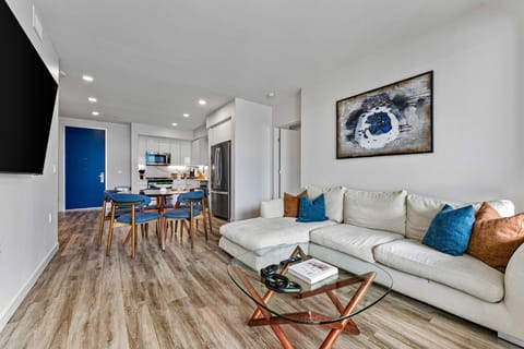 Bright and airy interior with a large sectional and designer touches. 
