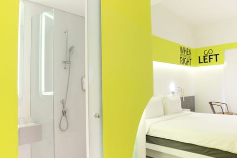 Room (Yello) | Bathroom | Shower, free toiletries, hair dryer, towels