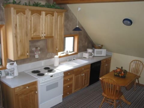 Suite, 1 Bedroom | Private kitchen | Full-size fridge, microwave, stovetop, dishwasher