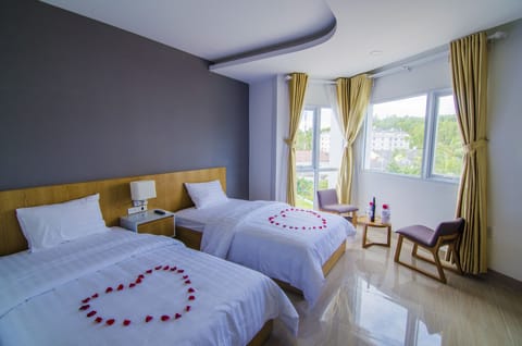 Deluxe Triple Room, Sea View | Premium bedding, memory foam beds, minibar, desk