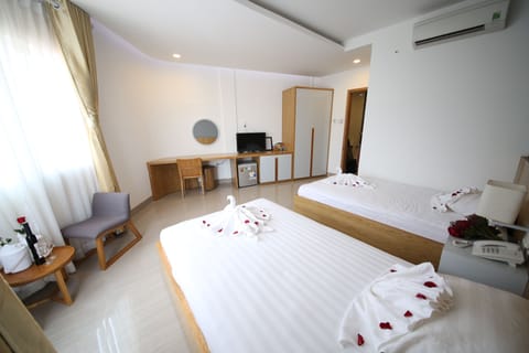 Deluxe Triple Room, City View | Premium bedding, memory foam beds, minibar, desk