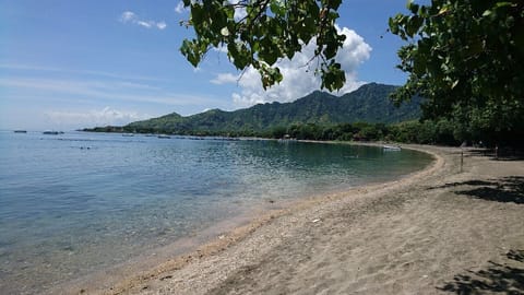 Beach nearby, black sand, beach towels