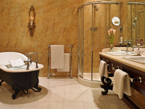 Deep soaking tub, designer toiletries, hair dryer, bathrobes