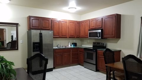 Premium Suite, 1 Bedroom, Jetted Tub | Private kitchen | Full-size fridge, microwave, stovetop