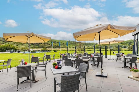 Sip and lounge comfortably while the dunes glow in sunlight.