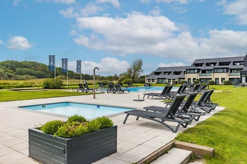 Start slow mornings beside sparkling water and peaceful green lawns.