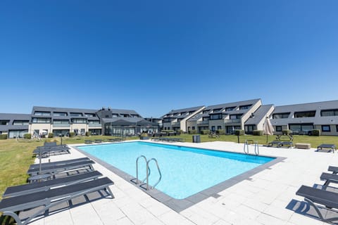 Dive into sunny pool days with spacious loungers and views.
