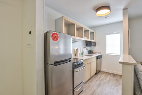 Suite, 2 Bedrooms | Private kitchen | Fridge, microwave, stovetop, dishwasher