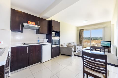 Apartment, 1 Bedroom | Living area | 0-inch flat-screen TV with digital channels, TV