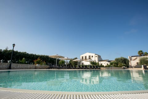 Outdoor pool, open 8:00 AM to 7:00 PM, pool umbrellas, sun loungers