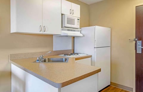 Studio, 1 King Bed, Non Smoking | Private kitchen | Fridge, microwave, stovetop