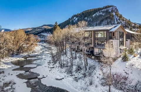 Sunlight on snow, the Eagle River whispering past frozen banks, and your patio door just 30 feet away. This is the Colorado winter you`ve always pictured