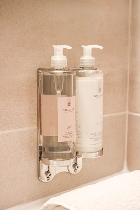 Shower, rainfall showerhead, designer toiletries, hair dryer