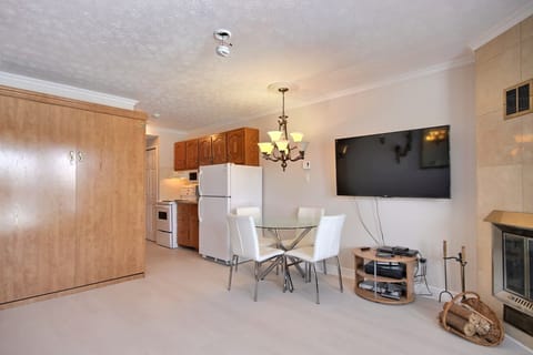 Studio, Marina View | Living area | 1-inch flat-screen TV with cable channels, TV, fireplace