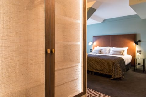 Superior Triple Room | Minibar, in-room safe, individually decorated, desk