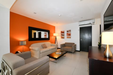 Two Bedroom Suite | Living area | 32-inch LCD TV with cable channels, TV