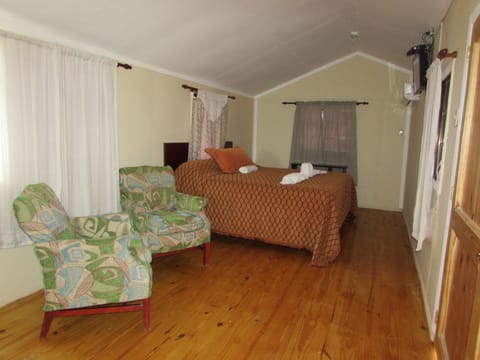 Panoramic Villa, 1 King Bed, Microwave, Lagoon View | Living room | 23-inch flat-screen TV with cable channels, TV