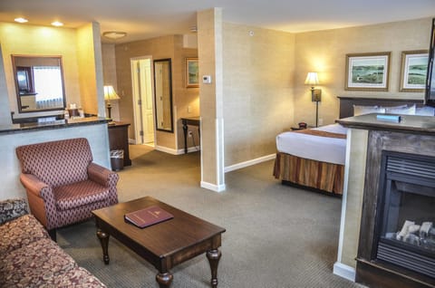 Suite, 1 King Bed, Non Smoking, Fireplace | Premium bedding, in-room safe, laptop workspace, blackout drapes