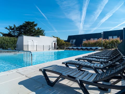 Blue water, blue sky: the pool on a clear Brittany afternoon
