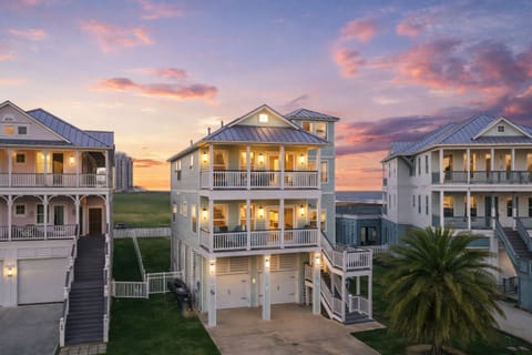Beautiful beachfront vacation home in Galveston Beach featuring a spacious multi-story coastal design with large balconies and stunning Gulf views.