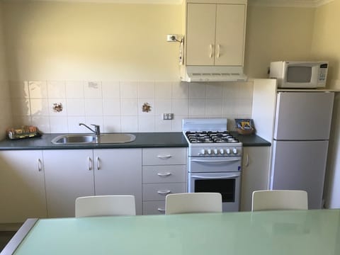 Apartment, Kitchen, Garden Area | Private kitchen | Fridge, microwave, coffee/tea maker, electric kettle